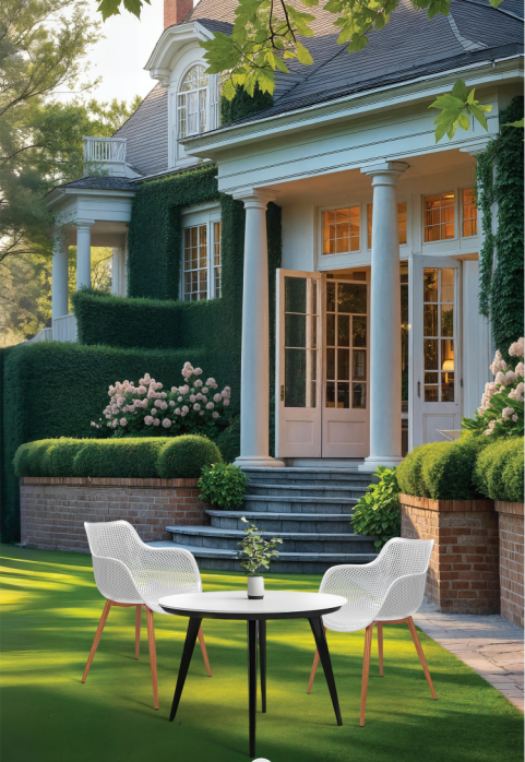 White Ikon perforated cafe armchairs with wooden finish legs on a lawn